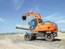 Вид 1: DOOSAN DX140W колесный экскаватор