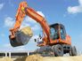 Вид 1: DOOSAN DX160W колесный экскаватор